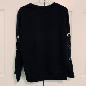 black sweater w/ criss cross sleeves